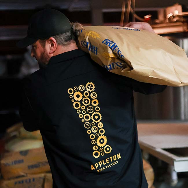 Appleton Beer Factory brewery and brew pub restaurant bar employee hauls grain Appleton Beer Factory brewery and brew pub restaurant bar employee hauls grain