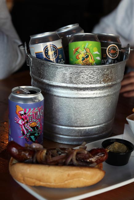 Brats and buckets of beer served at Appleton Beer Factory brewery and brew pub restaurant bar
